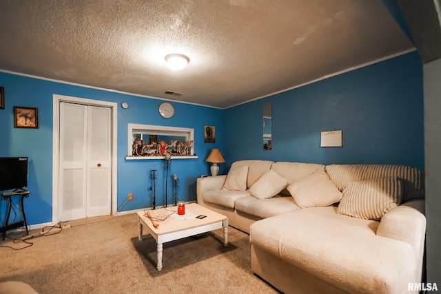 living room featuring ornamental molding, carpet floors, and a textured ceiling