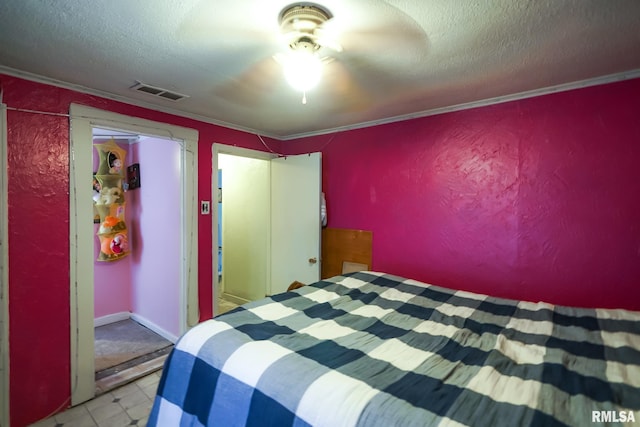 unfurnished bedroom featuring crown molding and a textured ceiling