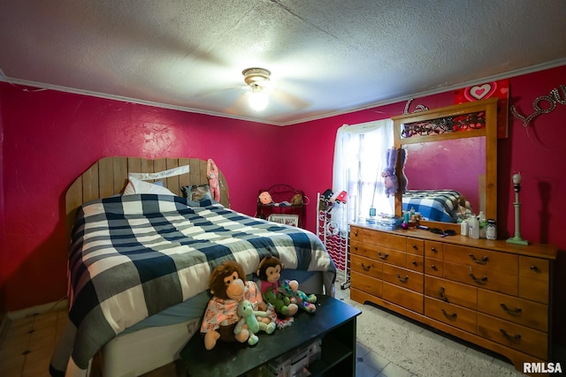 bedroom with ceiling fan and a textured ceiling