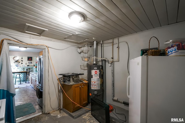 utility room featuring water heater