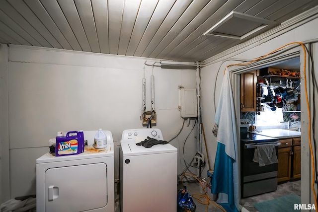 laundry room featuring separate washer and dryer and wood ceiling