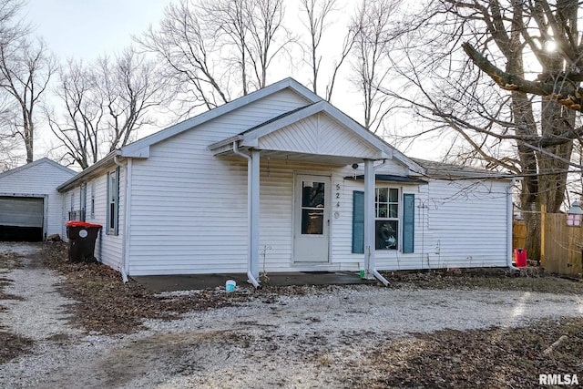 bungalow-style home featuring an outbuilding and a garage