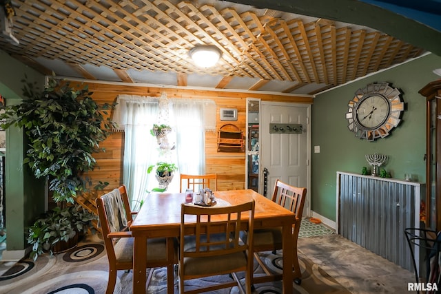 dining area with wooden walls