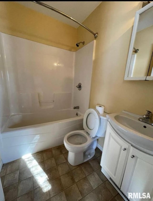 full bathroom with shower / bathing tub combination, vanity, and toilet