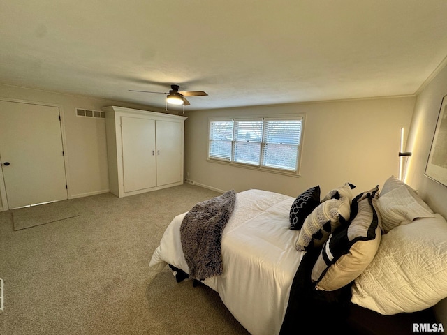 carpeted bedroom featuring ceiling fan