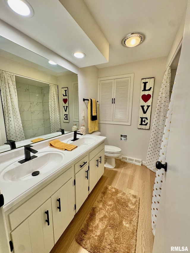 bathroom with vanity, a shower with curtain, wood-type flooring, and toilet