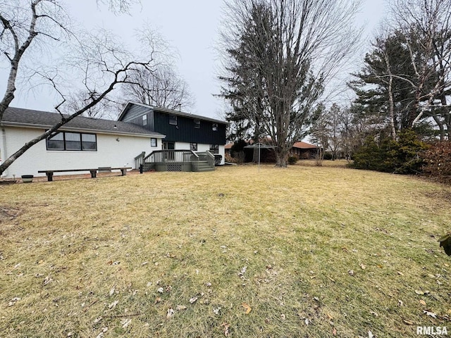 view of yard with a wooden deck