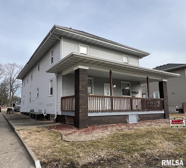 view of front facade featuring central AC unit and covered porch