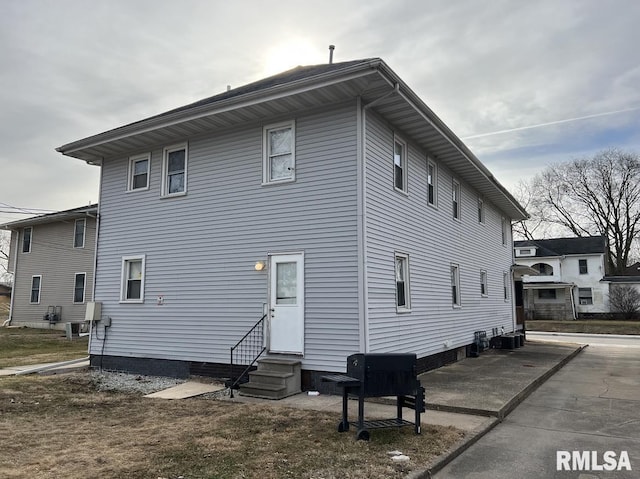 back of property featuring a patio