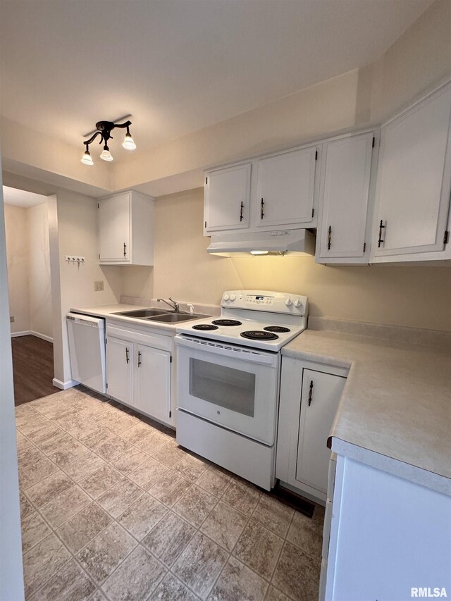 kitchen featuring white cabinetry, white appliances, and sink