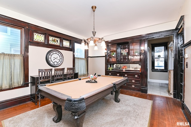 game room with dark hardwood / wood-style flooring and pool table