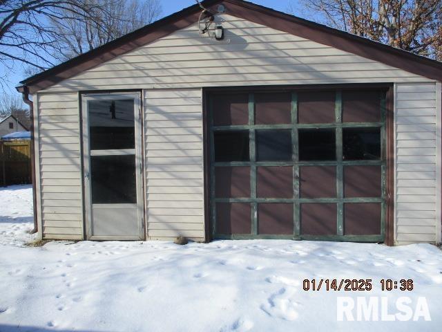 view of snow covered garage