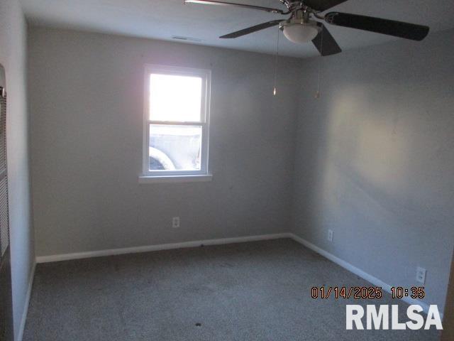 empty room with carpet and ceiling fan