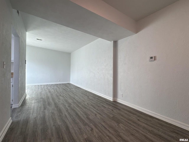 empty room featuring dark hardwood / wood-style floors