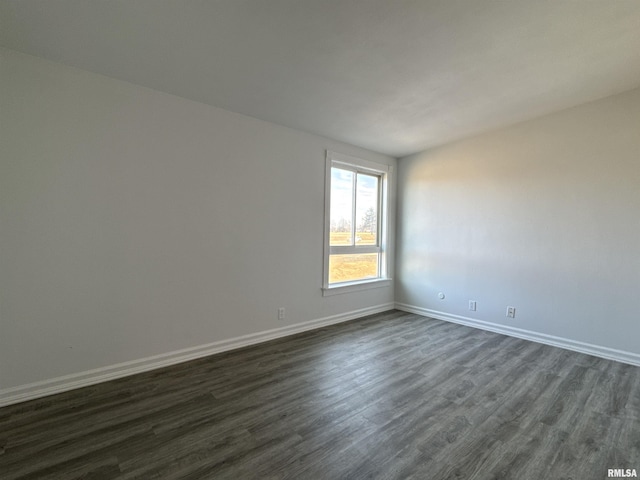 unfurnished room featuring dark hardwood / wood-style floors