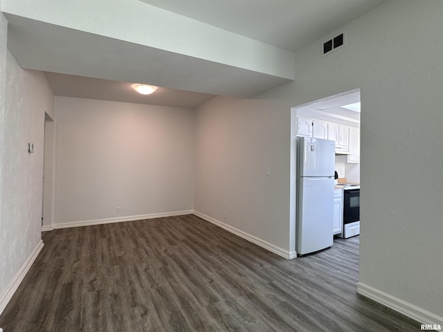 unfurnished room featuring dark hardwood / wood-style floors