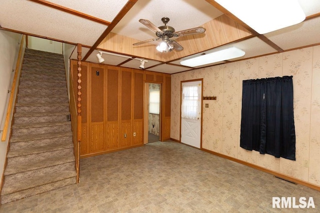 unfurnished living room featuring ceiling fan