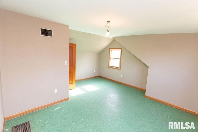 bonus room with vaulted ceiling