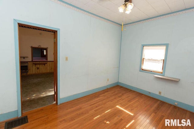 unfurnished room featuring hardwood / wood-style floors