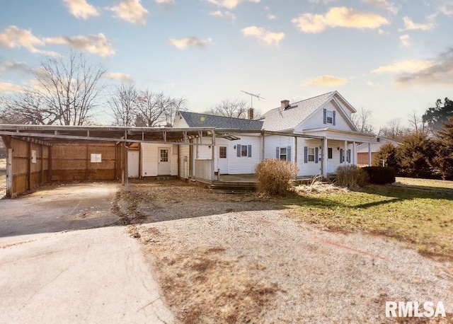 view of front of home with a carport