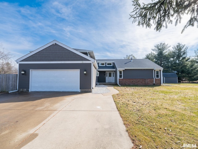 view of front of property with a garage and a front lawn