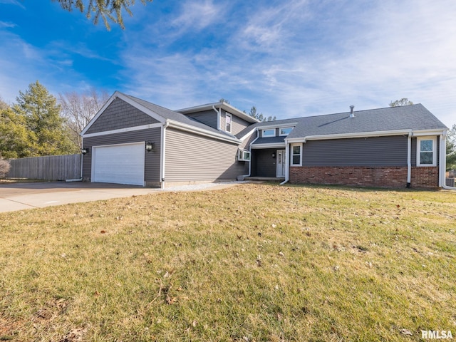 view of front of home featuring a garage and a front lawn