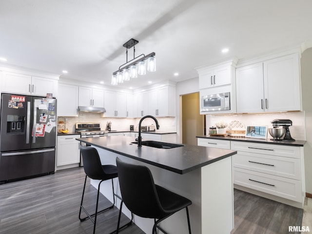 kitchen featuring sink, fridge with ice dispenser, white microwave, and white cabinets