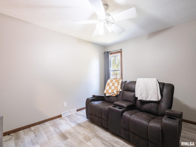 interior space with ceiling fan and light hardwood / wood-style flooring