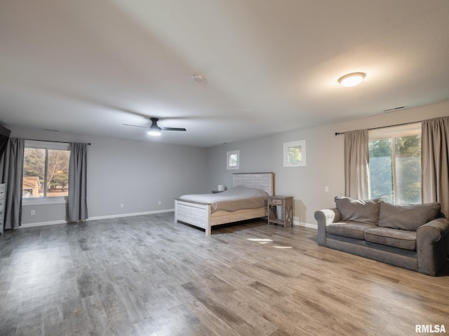 unfurnished bedroom featuring hardwood / wood-style flooring and ceiling fan