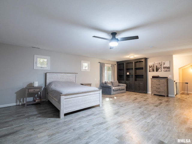 bedroom featuring hardwood / wood-style flooring and ceiling fan