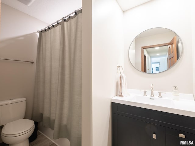 full bathroom featuring vanity, toilet, and shower / tub combo