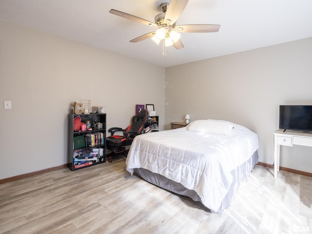 bedroom with ceiling fan and light hardwood / wood-style flooring