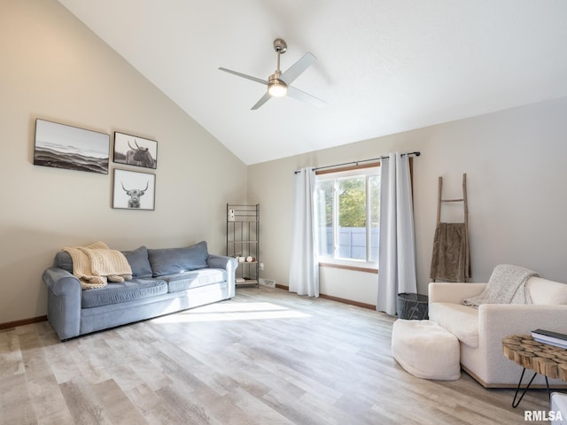 living room with vaulted ceiling, ceiling fan, and light hardwood / wood-style floors