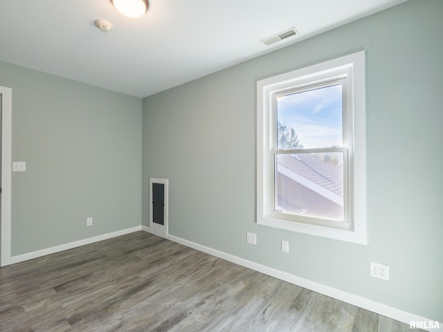 spare room with hardwood / wood-style flooring