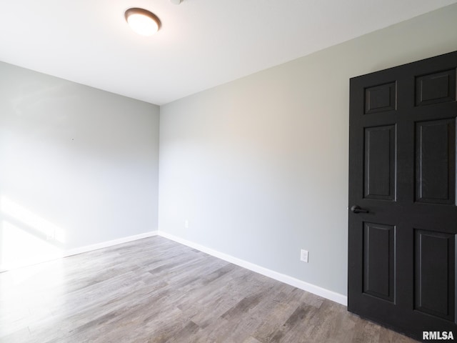 spare room featuring light hardwood / wood-style flooring