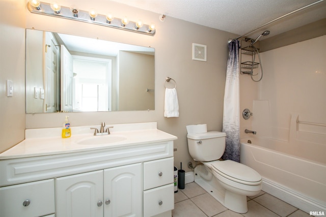 full bathroom with vanity, toilet, shower / bath combo, tile patterned floors, and a textured ceiling