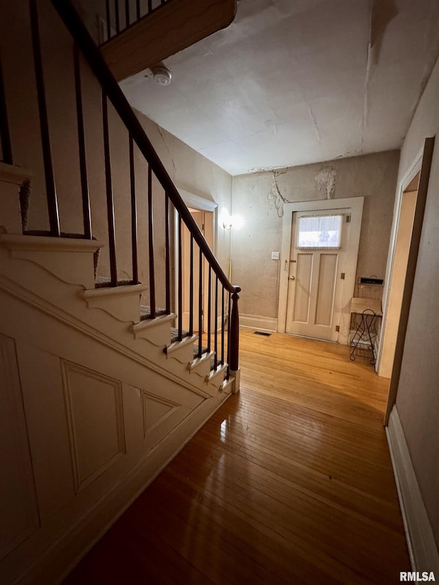 staircase featuring hardwood / wood-style floors