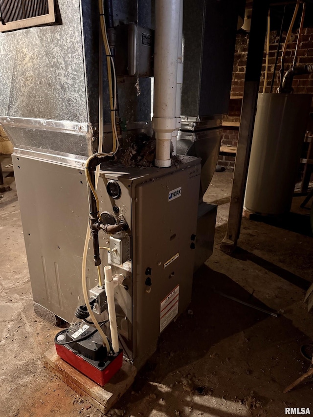 utility room with heating unit and gas water heater