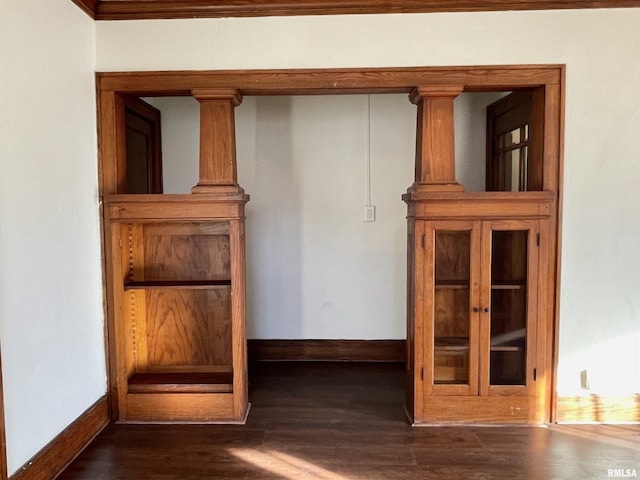 room details with hardwood / wood-style floors and decorative columns