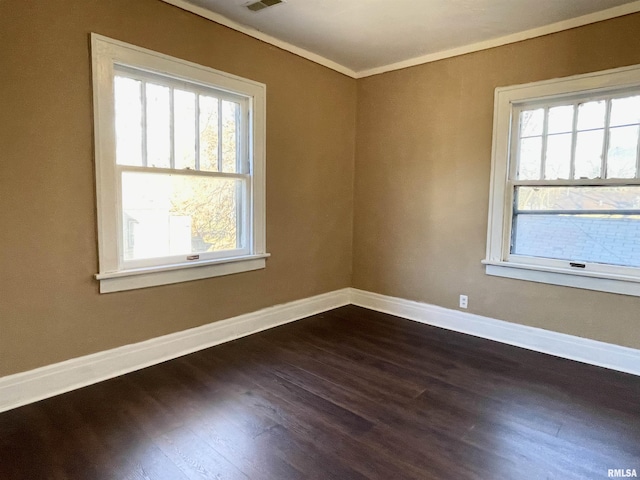 unfurnished room with dark wood-type flooring and ornamental molding