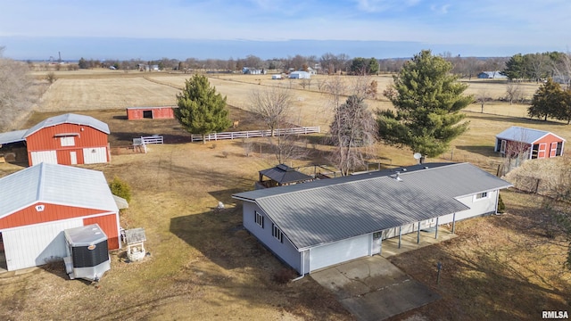 birds eye view of property with a rural view