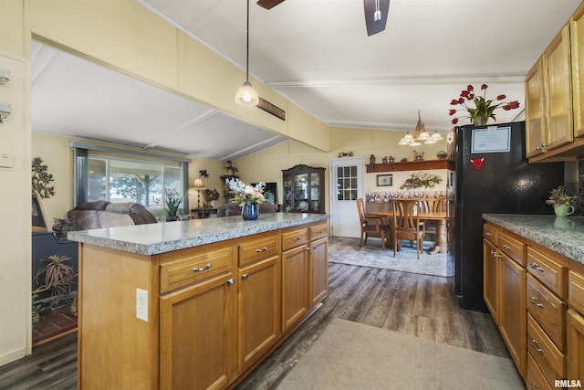 kitchen with dark hardwood / wood-style flooring, decorative light fixtures, lofted ceiling with beams, and a center island