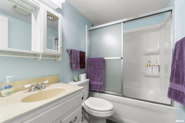 full bathroom featuring vanity, toilet, and combined bath / shower with glass door