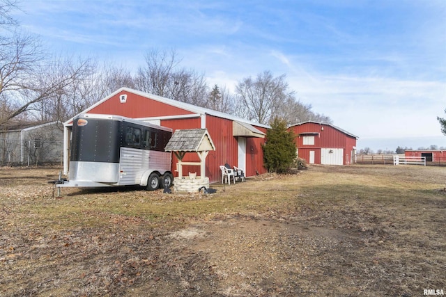 view of outbuilding with a yard