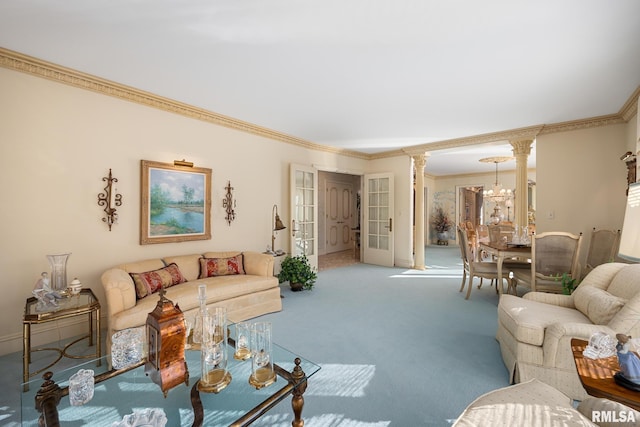 living room with decorative columns, crown molding, carpet, and a chandelier