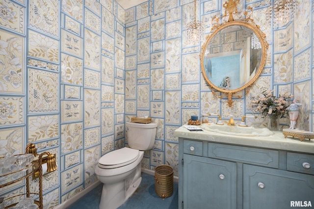 bathroom with vanity and toilet