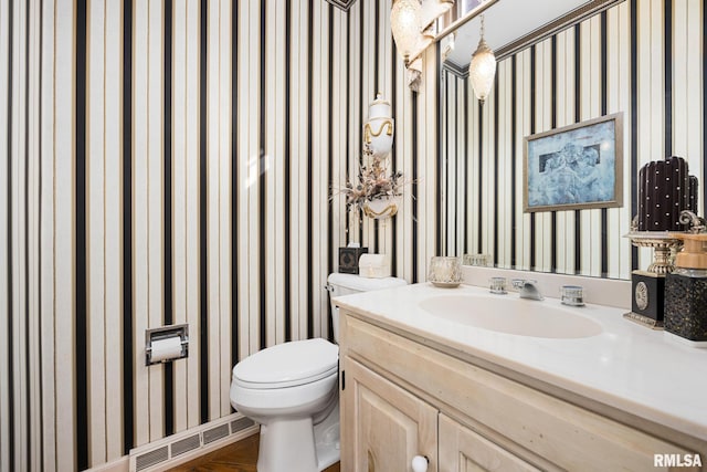 bathroom with vanity and toilet