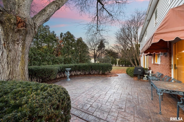 view of patio terrace at dusk