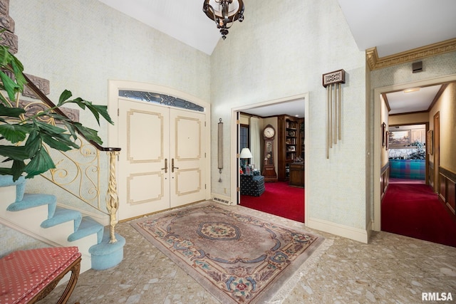 foyer featuring crown molding