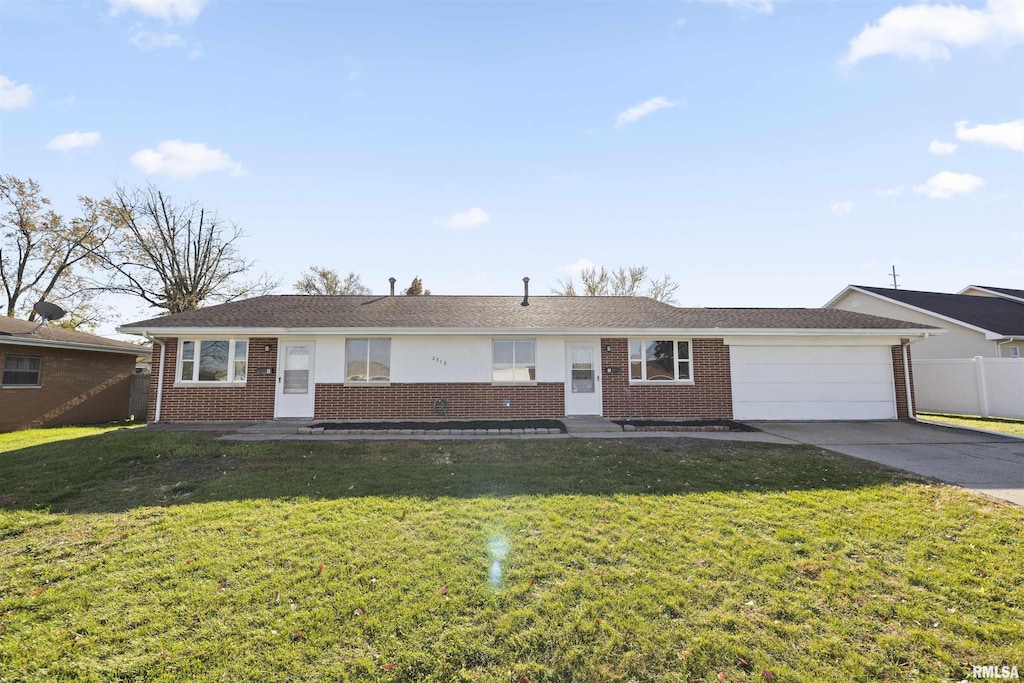 single story home featuring a garage and a front yard